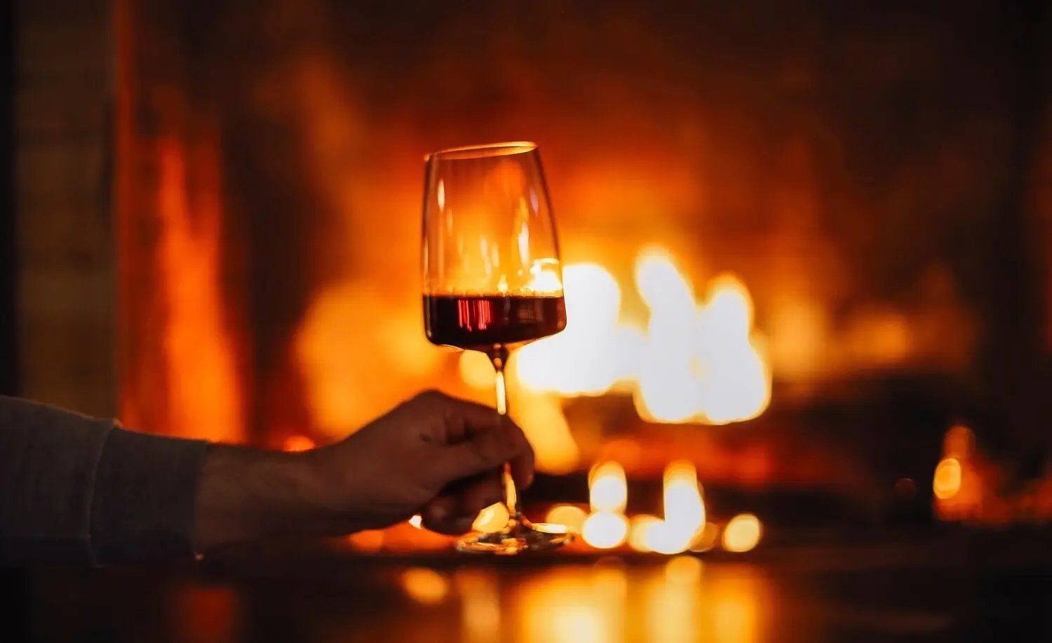 Red Wine By The Fireplace - Image by Dasha Petrenko